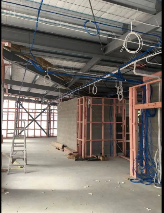 Cabling run through the steel frame of a commercial building under construction