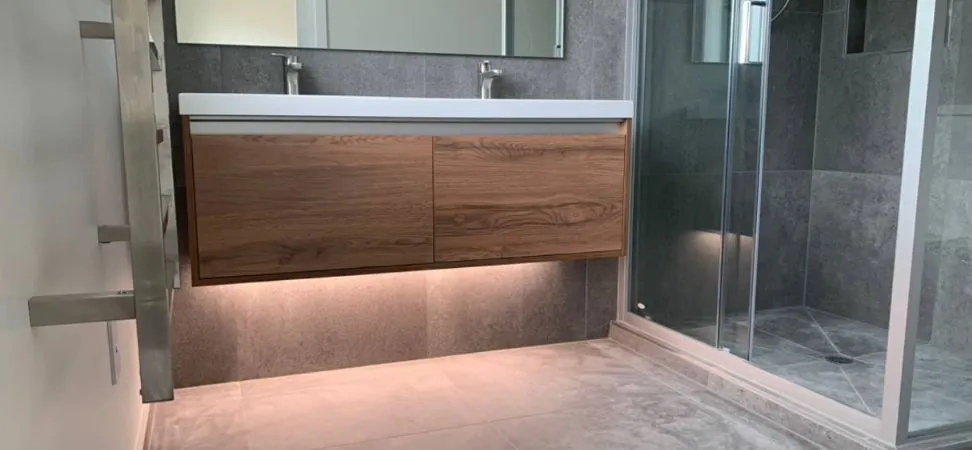 Floating timber vanity with LED light glowing underneath